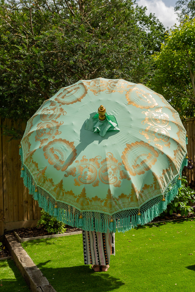 Mint green and gold fringed garden parasol