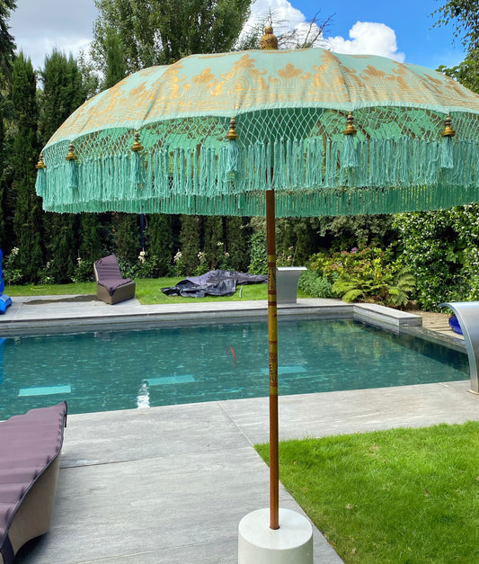 Mint green and gold fringed garden parasol