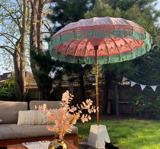 Pink and green fringed garden parasol